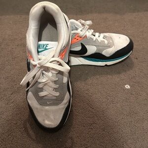 Nike Gray and Black Sneakers with Orange and Teal Highlights